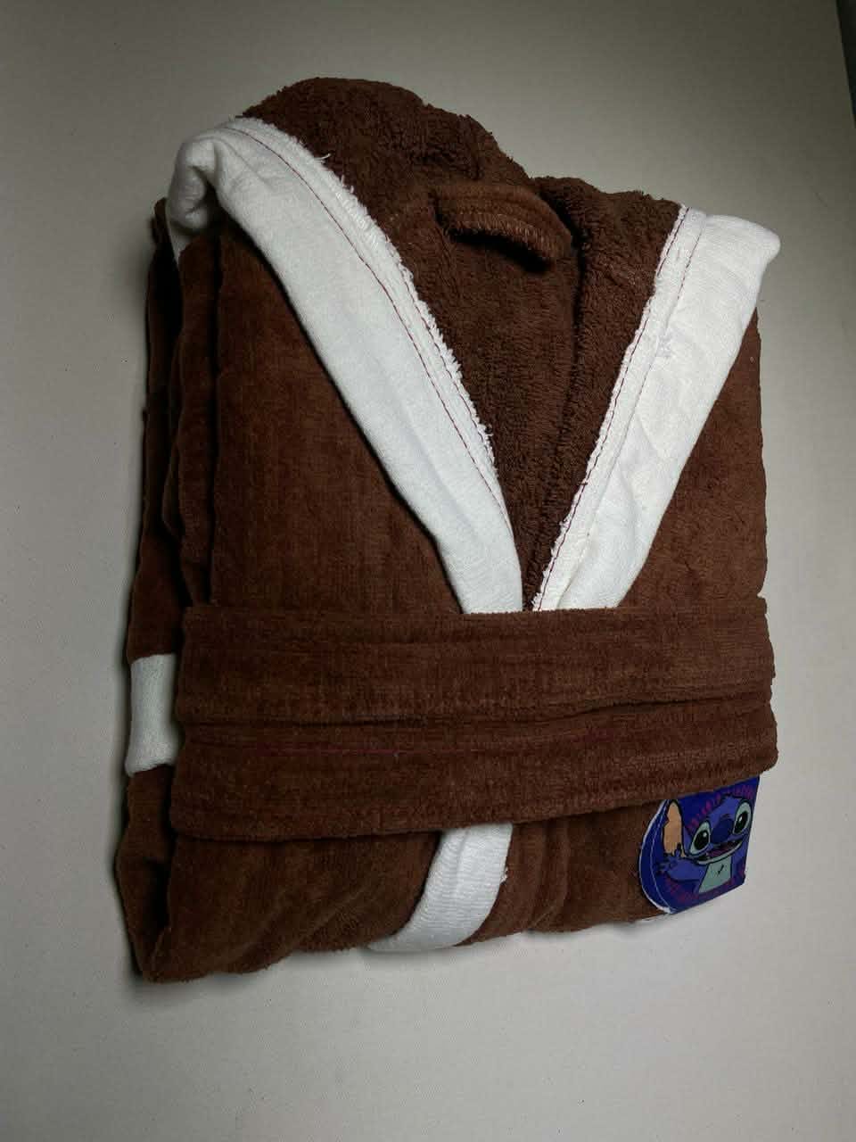 White kids bath robe folded